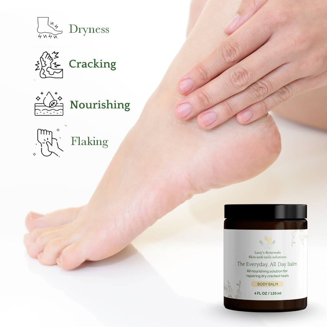 A hand applying the balm to a bare foot